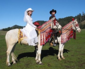 Faraj and Chardonney, still strong after all these years, carry a happy couple to their nuptials